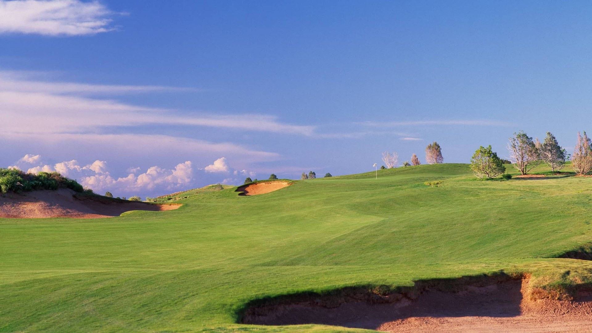 Green and deep sand bunker at Butterfield Trail Golf Club in El Paso.
