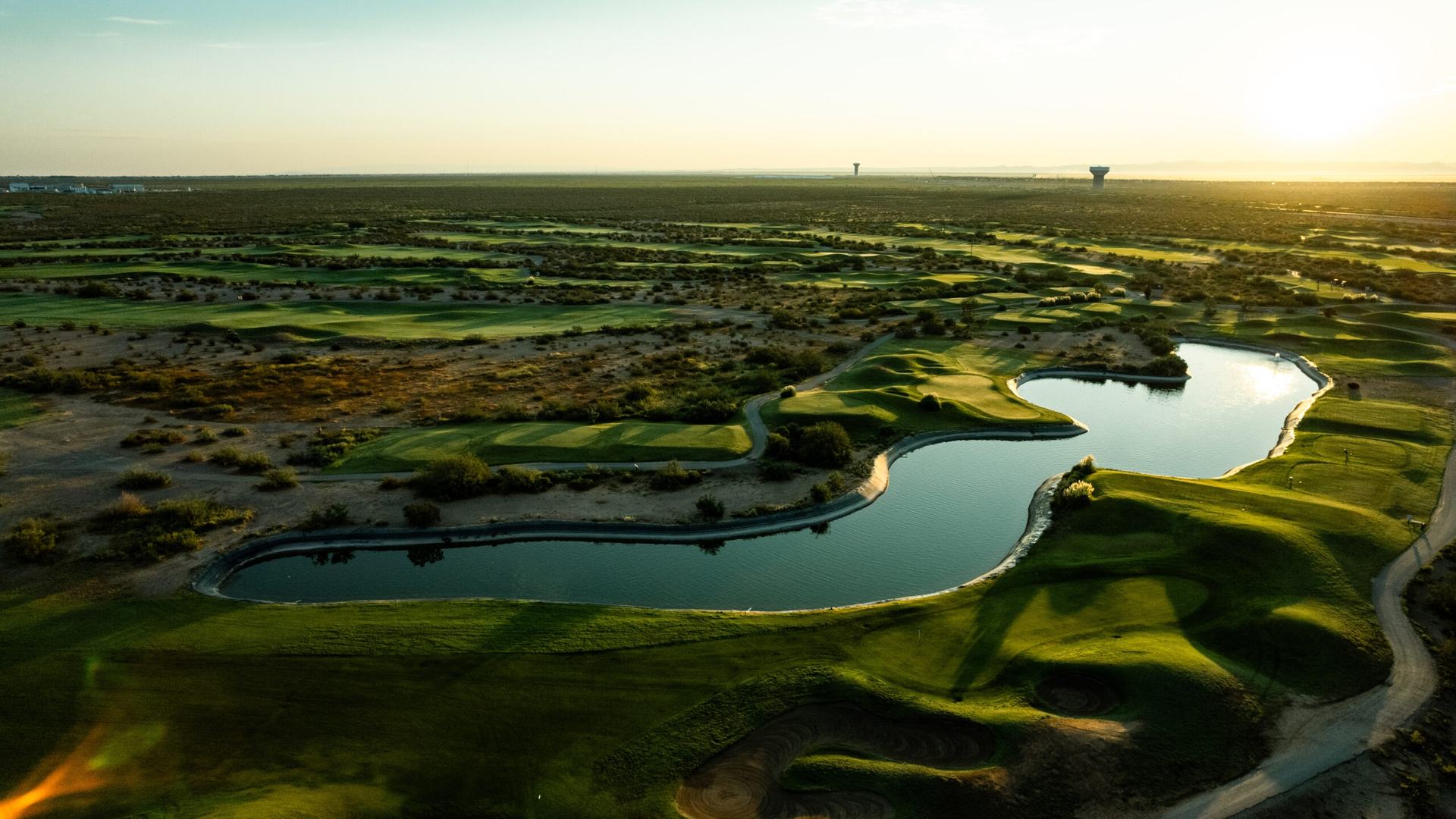 Aerial view of fairways and a pond at the Painted Dunes golf facility in El Paso.