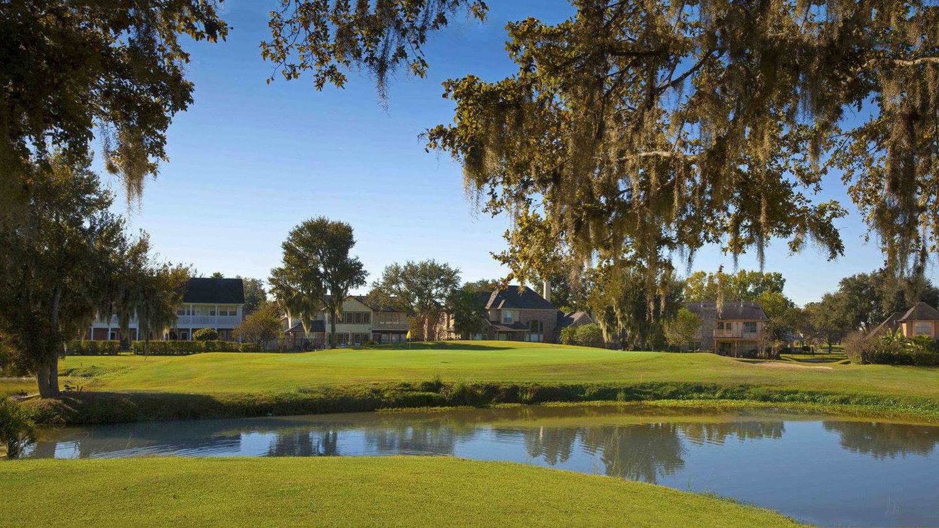 Pond and tree-lined fairway on the La Quinta course at Quail Valley in Missouri City.