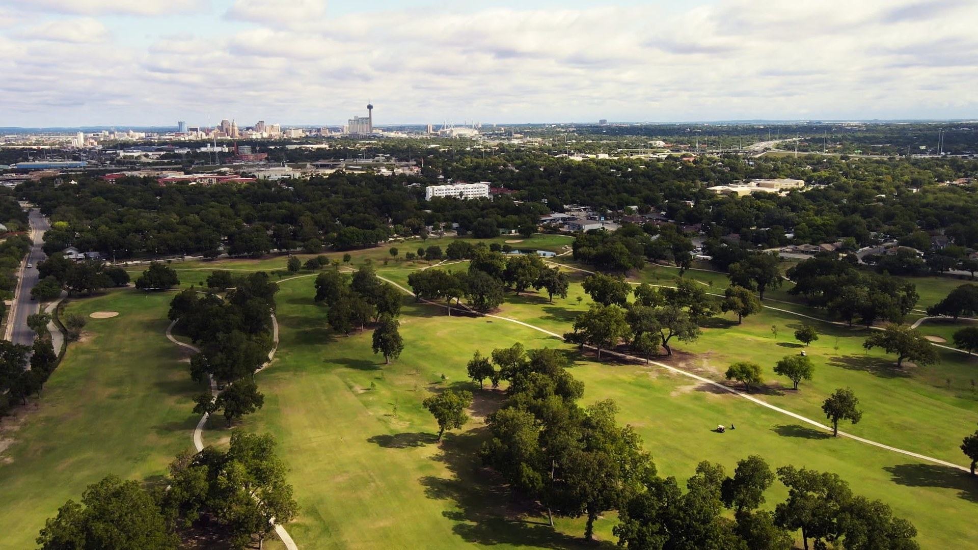 Aerial view of Riverside Golf Course with tree-lined fairways in San Antonio.
