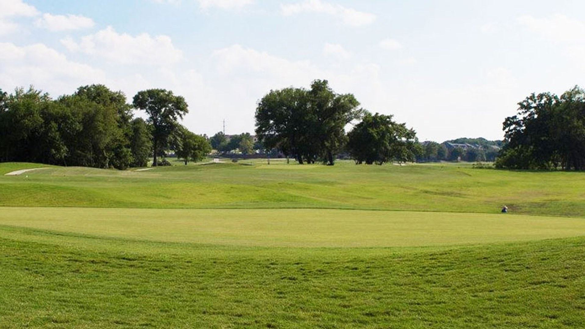 Green and flag at The Players Course at Watters Creek in Plano.
