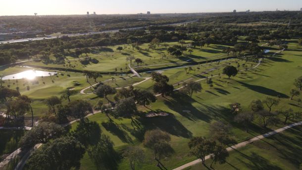Aerial view of tree-lined fairways at Olmos Basin Golf Course in San Antonio.