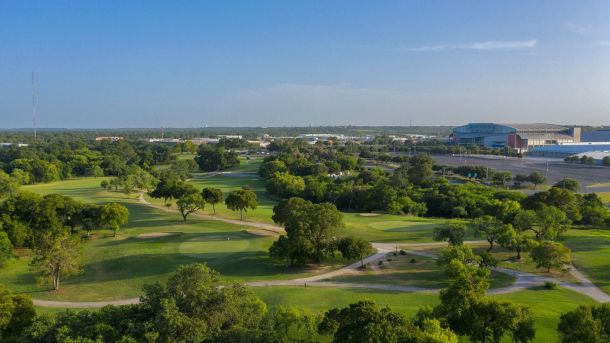 Aerial view of Willow Springs Golf Course with the Alamodome in the San Antonio skyline.