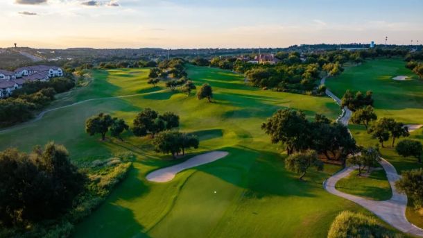 Aerial view of rolling fairways, greens, and bunkers at Falconhead Golf Club in Austin.
