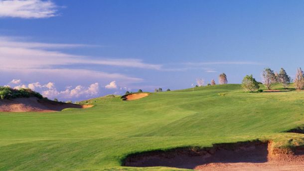 Green and deep sand bunker at Butterfield Trail Golf Club in El Paso.